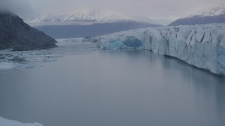 AK0001_0049 - 4K aerial stock footage flying low over a lake near the edge of a glacier, Knik, Alaska
