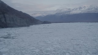 AK0001_0054 - 4K aerial stock footage flying low over surface of a glacier, revealing ice covered lake, Knik, Alaska