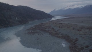 AK0001_0057 - 4K aerial stock footage flying low over a lake narrowing into a river, Knik, Alaska