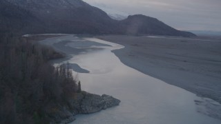 AK0001_0060 - 4K aerial stock footage flying over countryside, river, approaching valley, Chugach Mountains, Knik, Alaska