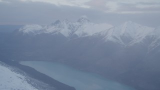 AK0001_0074 - 4K aerial stock footage flying by Chugach Mountains and Eklutna Lake, Alaska