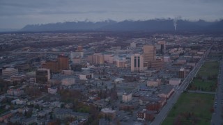 AK0001_0108 - 4K aerial stock footage orbit Downtown, Chugach Mountains, Downtown Anchorage, Alaska, twilight