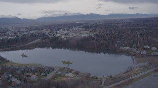 AK0001_0160 - 4K aerial stock footage flying over Westchester Lagoon, Anchorage, Alaska