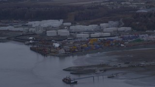 AK0001_0165 - 4K aerial stock footage flying by an oil refinery, shore of the Knik Arm of Cook Inlet, Anchorage, Alaska