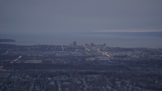 AK0001_0182 - 4K aerial stock footage near Debarr Road, flying by Downtown Anchorage, Alaska, twilight