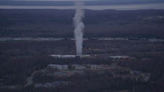 AK0001_0183 - 4K aerial stock footage flying by a power plant, Anchorage, Alaska, twilight