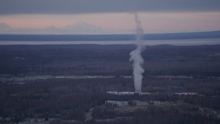 AK0001_0184 - 4K aerial stock footage flying by a power plant, Anchorage, Alaska, twilight