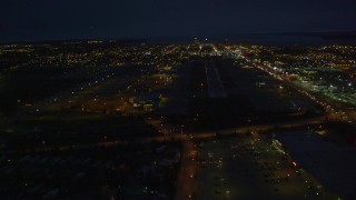 AK0001_0197 - 4K aerial stock footage approaching Merrill Field, landing aircraft, Anchorage, Alaska, night