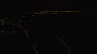 AK0001_0202 - 4K aerial stock footage following Glenn Highway, Eagle River, Alaska, night