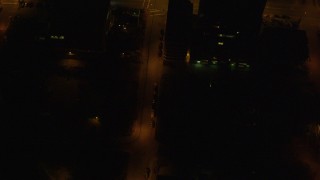 AK0001_0210 - 4K aerial stock footage of a bird's eye view of city streets in Downtown Anchorage, Alaska, night