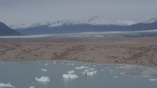 AK0001_0211 - 4K aerial stock footage fly over Inner Lake George, approach Chugach Mountains and Knik Glacier, Alaska