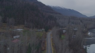 AK0001_0218 - 4K aerial stock footage following Old Glenn Highway, approaching Chugach Mountains, Knik River, Alaska