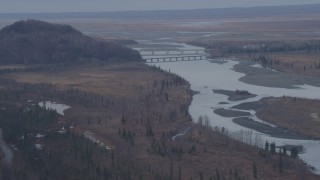 AK0001_0222 - 4K aerial stock footage flying by Glenn Highway Bridge, spanning the Knik River, Alaska