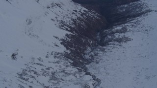 AK0001_0266 - 4K aerial stock footage following river, revealing deep valley, Chugach Mountains, Alaska