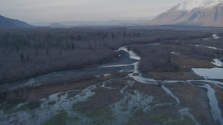 AK0001_0287 - 4K aerial stock footage descend toward river, towards the Chugach Mountains, Knik River Valley, Alaska