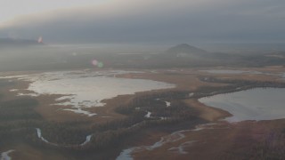 AK0001_0290 - 4K aerial stock footage flying by three lakes with a river winding between them, Jim Lake, Alaska 