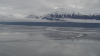 AK0001_0355 - 4K aerial stock footage flying by Kenai Mountains, from low over Turnagain Arm of the Cook Inlet, Alaska