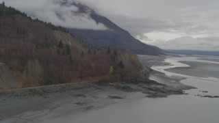 AK0001_0356 - 4K aerial stock footage train tracks, Chugach Mountains, from Turnagain Arm of the Cook Inlet, Alaska