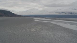 AK0001_0361 - 4K aerial stock footage flying low over the water, Turnagain Arm of the Cook Inlet, Alaska