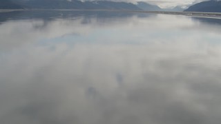 AK0001_0369 - 4K aerial stock footage tilt from water, reveal Chugach Mountains, Turnagain Arm of the Cook Inlet, Alaska