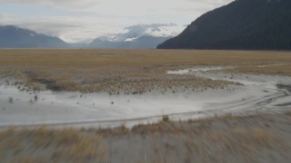 AK0001_0375 - 4K aerial stock footage flying low over grassland, Portage, Alaska