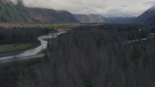 AK0001_0387 - 4K aerial stock footage flying low over trees, revealing a river, Portage, Alaska