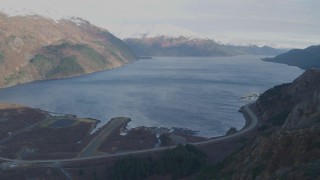 AK0001_0395 - 4K aerial stock footage fly over Whittier Airport, approach bay, reveal West Camp Road, Whittier, Alaska