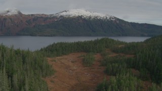 AK0001_0410 - 4K aerial stock footage approaching tree lined shore of Esther Lake, Esther Island, Alaska