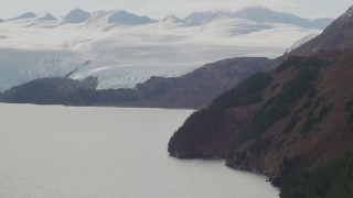 AK0001_0465 - 4K aerial stock footage slopes of Chugach Mountains on coast, approach glacier, Blackstone Bay, Alaska