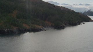 AK0001_0468 - 4K aerial stock footage tilt up revealing shoreline, reveal glacier and island, Blackstone Bay, Alaska