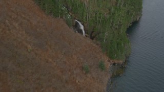 AK0001_0489 - 4K aerial stock footage flying along rocky shoreline revealing waterfalls, Blackstone Bay, Alaska