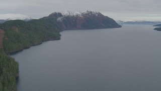 AK0001_0492 - 4K aerial stock footage flying over the bay, pan left approaching the shoreline, Blackstone Bay, Alaska