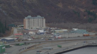 AK0001_0500 - 4K aerial stock footage flying by an apartment building, train tracks, Whittier, Alaska