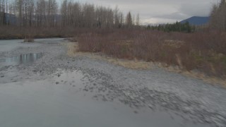 AK0001_0514 - 4K aerial stock footage flying low over rivers cutting through the valley, Portage, Alaska