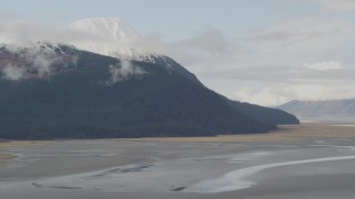 AK0001_0521 - 4K aerial stock footage flying by rocky slopes, Kenai Mountains, Alaska