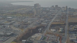 AK0001_0583 - 4K aerial stock footage flying by East 5th Avenue, tilt up, revealing Downtown Anchorage, Alaska