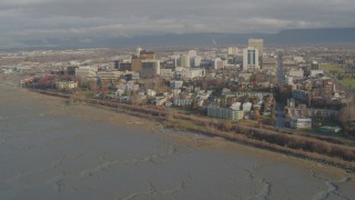 AK0001_0590 - 4K aerial stock footage flying over the shore, approaching Downtown Anchorage, Alaska
