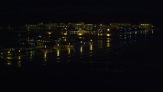 AK0001_0600 - 4K aerial stock footage flying by Merrill Field, Anchorage, Alaska, night