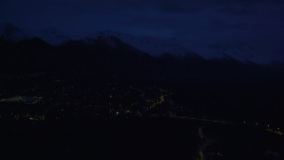 AK0001_0605 - 4K aerial stock footage fly by neighborhood lights, base of Chugach Mountains, Anchorage, Alaska, night