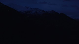 AK0001_0606 - 4K aerial stock footage flying by communications tower, Chugach Mountains, Anchorage, Alaska, sunrise