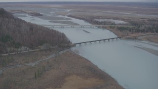 AK0001_0621 - 4K aerial stock footage the Glenn Highway Bridge, train bridge, spanning the Knik River, Alaska