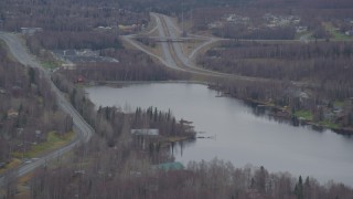 AK0001_0661 - 4K aerial stock footage approaching Lower Fire Lake, homes, Old Glenn Highway, Chugiak, Alaska