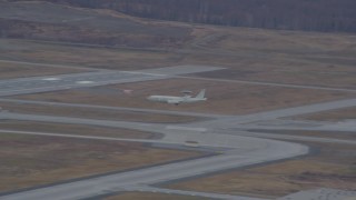 AK0001_0672 - Aerial stock footage of Tracking E-3 Sentry landing, Elmendorf Air Force Base, Alaska