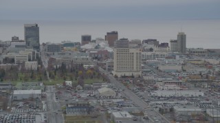 AK0001_0674 - 4K aerial stock footage ascend from Merrill Field, approaching Downtown Anchorage, Alaska