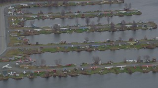 AK0001_0684 - 4K aerial stock footage seaplanes parked in Lake Hood Seaplane Base, Anchorage, Alaska