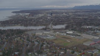 AK0001_0689 - 4K aerial stock footage flying over Anchorage West High School, approach Downtown Anchorage, Alaska