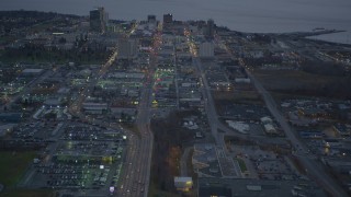 AK0001_0726 - 4K aerial stock footage following East 5th Avenue, revealing Downtown Anchorage, Alaska, twilight 