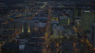 AK0001_0736 - 4K aerial stock footage following West 6th Ave, during winter, through Downtown Anchorage, Alaska, night
