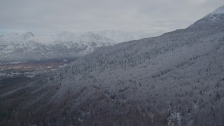 AK0001_0744 - 4K aerial stock footage approach snow-covered Chugach Mountains, Eagle River Valley, Eagle River, Alaska