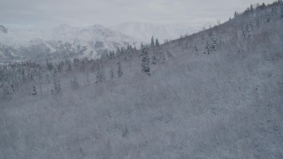 AK0001_0747 - 4K aerial stock footage reveal Eagle River Valley, snowy Chugach Mountains, Eagle River, Alaska